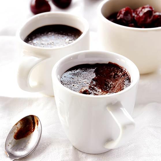 Chocolate pudding with cherry sauce