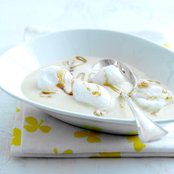 Snow eggs with vanilla custard and almond praline 